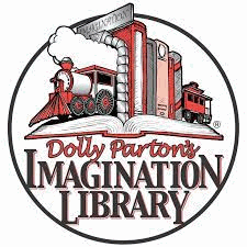 A row of books with train bookends on an open book. Caption reads Dolly Parton's Imagination Library